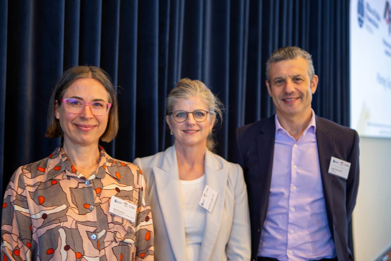 Panellists Kate Bundrock, Her Honour Judge Fiona Todd and Daniel Gurvich pose together after the close of their session.